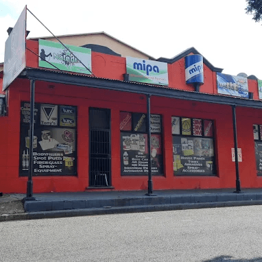 The QJ Paint World owners standing proudly outside the Alberton Trade Centre